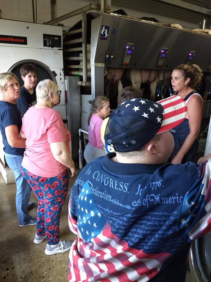 Ascend Services Inc day participants touring Soaring Eagle Dairy